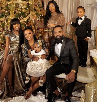 Riley Burruss with mother Kandi Burruss, stepdad and half-siblings